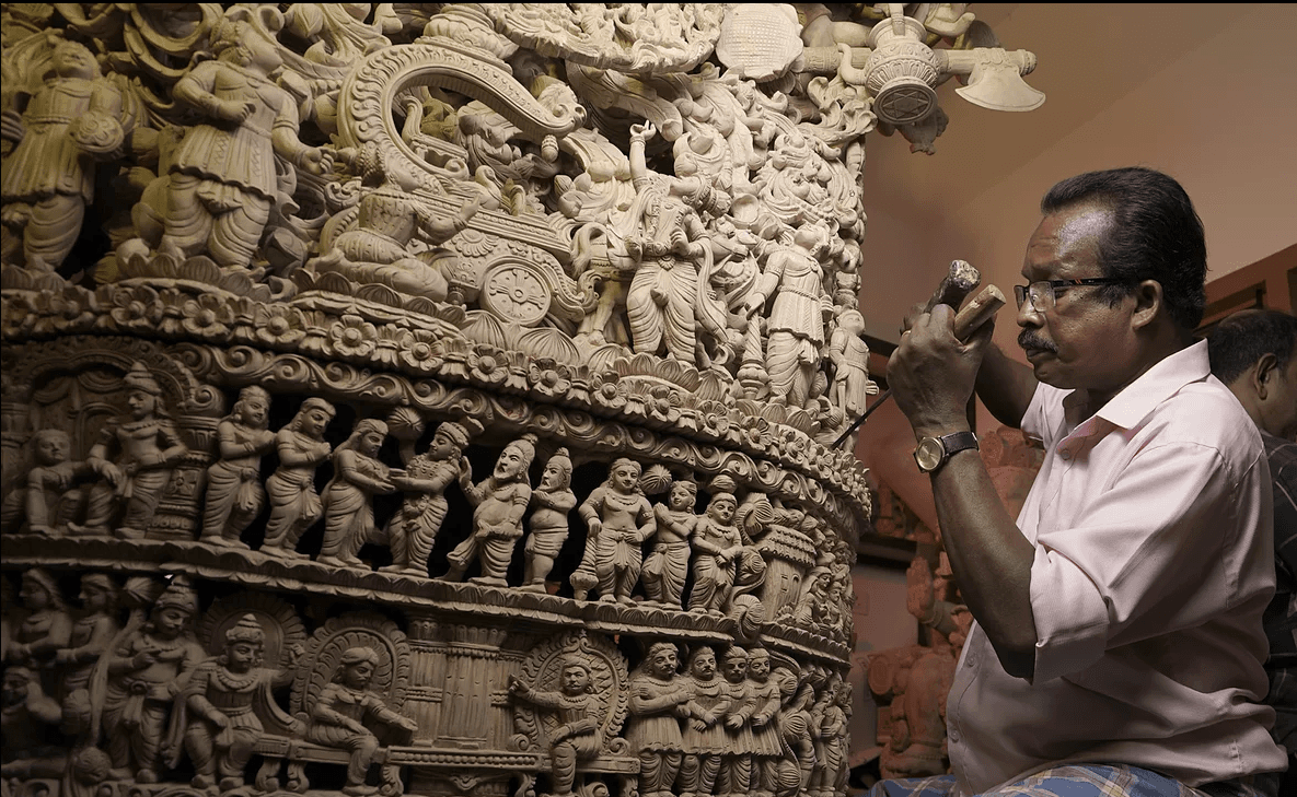 Master Artisan Shri Nagappan hand-carving a monumental sanctum sculpture